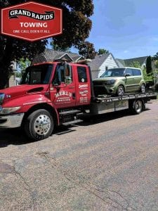 Towing Company Car on Flatbed Grand Rapids